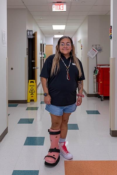 Danielle sporting a pink boot